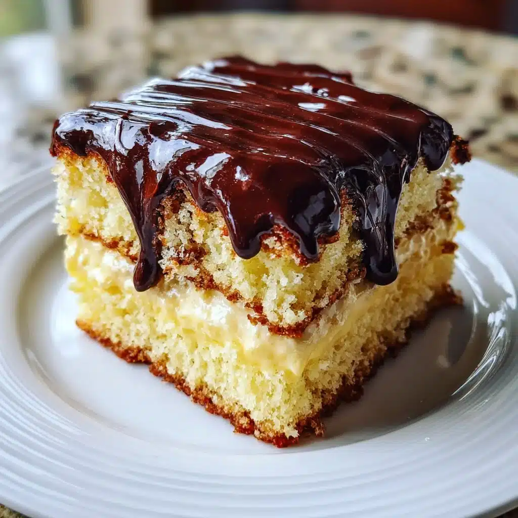 Delicious Boston Cream Poke Cake topped with chocolate and creamy filling.