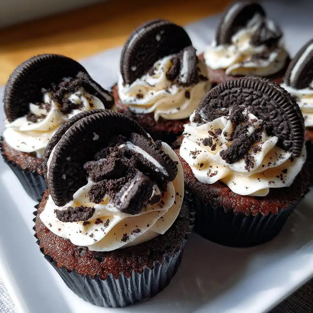 Delicious Cookies and Cream Cupcakes topped with creamy frosting and cookie bits.