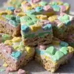 Delicious homemade Lucky Charms Treats with colorful marshmallows and crisped rice.