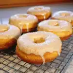 Freshly baked Vanilla French Doughnuts with a dusting of sugar