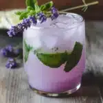 Refreshing Virgin Lavender Mojito served with fresh lavender and mint leaves.