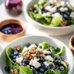 Colorful Easter spring salad topped with goat cheese and fresh vegetables