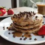 Delicious chocolate chip coffee pancakes stacked on a plate