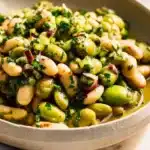Delicious green olive bean salad with fresh ingredients and vibrant colors.