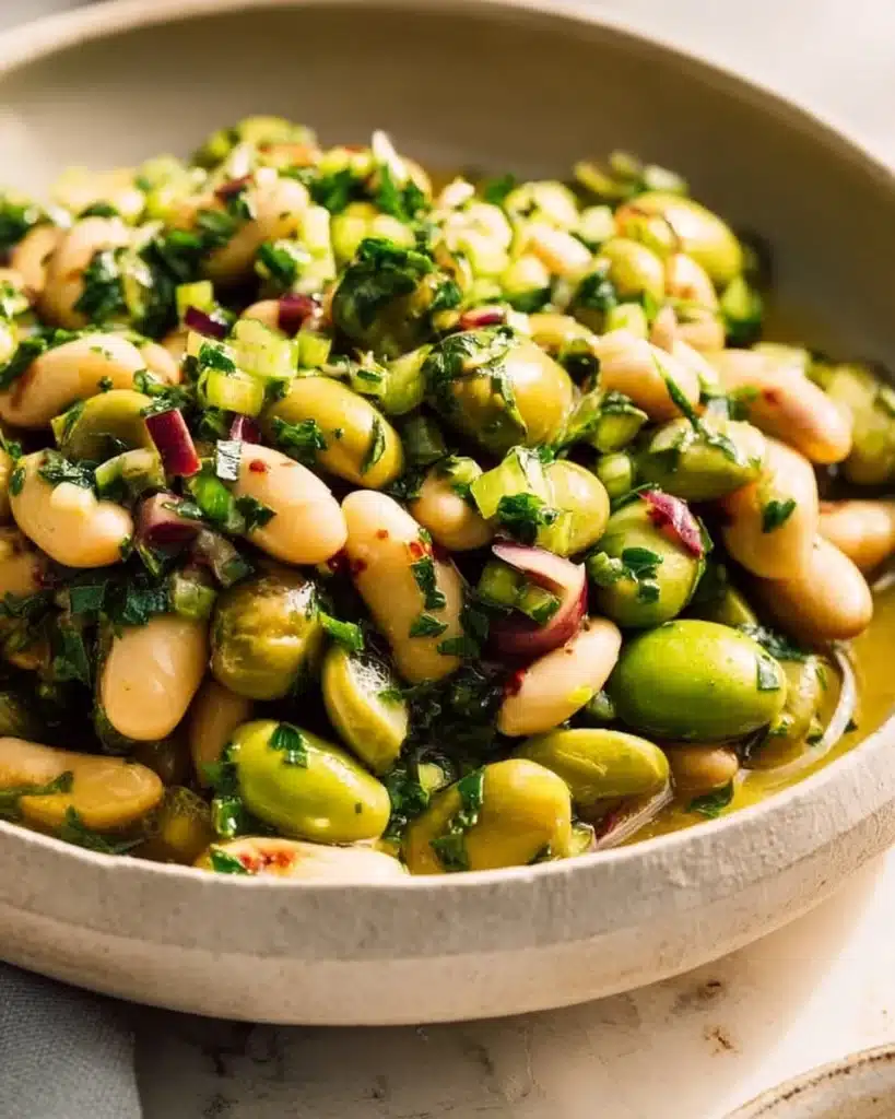 Delicious green olive bean salad with fresh ingredients and vibrant colors.