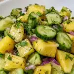 Delicious pineapple cucumber salad served in a bowl with fresh ingredients