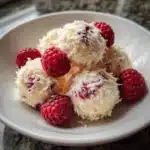 Delicious Raspberry Raffaello Cream dessert in a bowl with fresh raspberries
