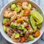 Delicious shrimp salad served in a bowl with fresh vegetables