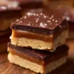 Delicious Twix Cookie Bars with chocolate, caramel, and cookies.