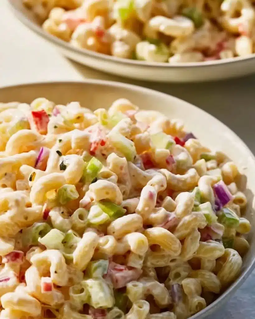 Delicious bowl of best macaroni salad with vegetables and dressing