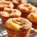 Cinnamon Sugar French Toast Muffins fresh out of the oven, garnished with sugar