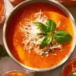 High Protein Tomato Soup in a bowl with garnishes