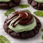 Delicious Crumbl-inspired mint brownie cookies on a plate.