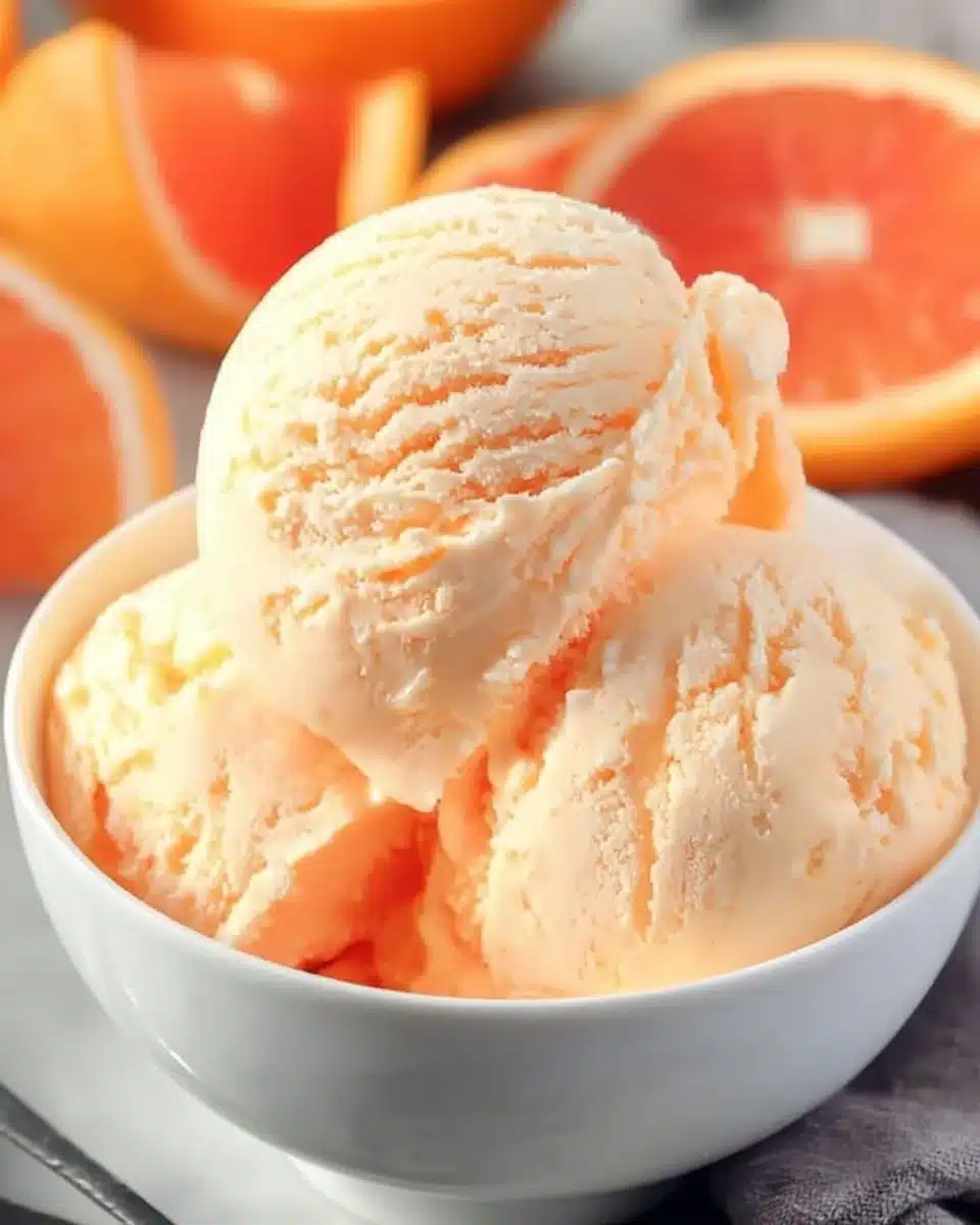 Delicious creamy orange ice cream served in a bowl