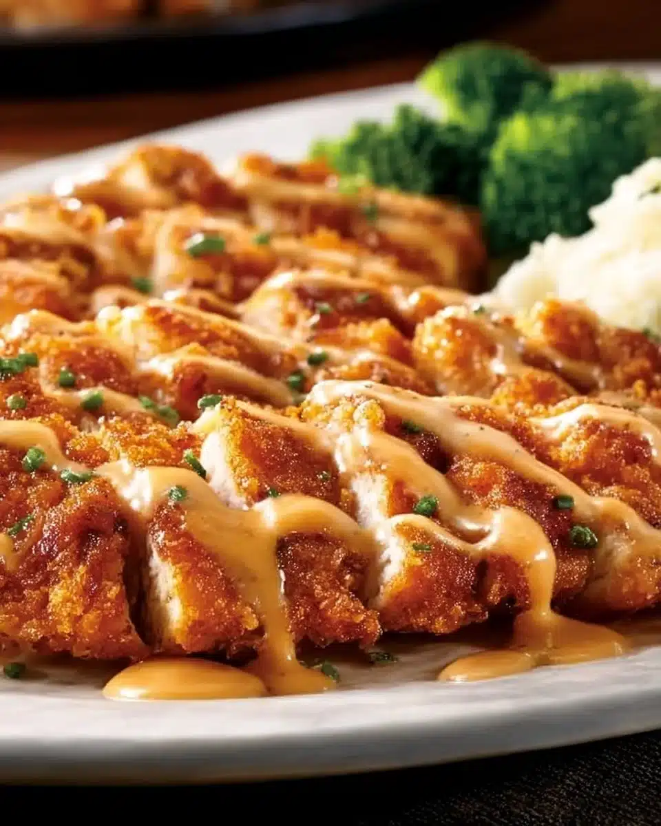 Delicious Outback Steakhouse Bloomin Fried Chicken served with sides