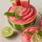 Refreshing watermelon smoothie in a glass garnished with mint leaves