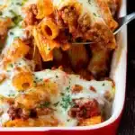 Baked rigatoni with cheese and sauce served in a baking dish