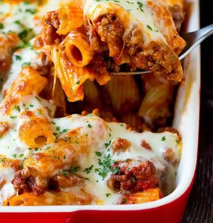 Baked rigatoni with cheese and sauce served in a baking dish