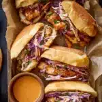 Bang Bang Chicken Sandwich served with spicy sauce and fresh toppings