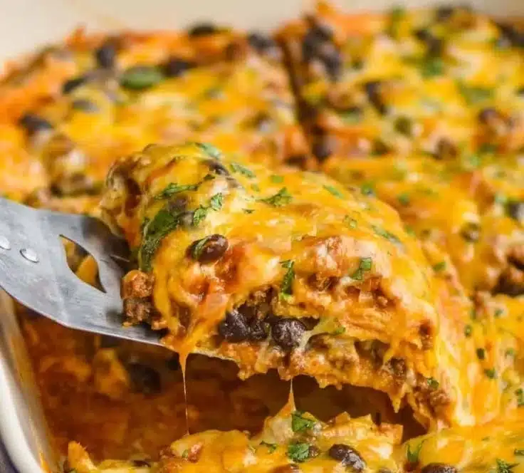 Delicious Beef Enchilada Casserole served with toppings