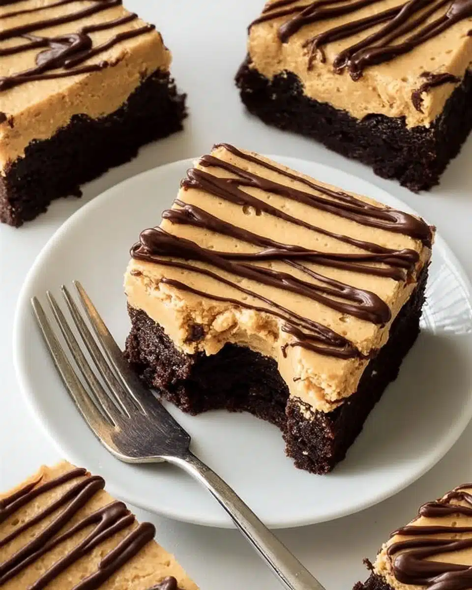 Brownies topped with creamy peanut butter frosting on a wooden plate