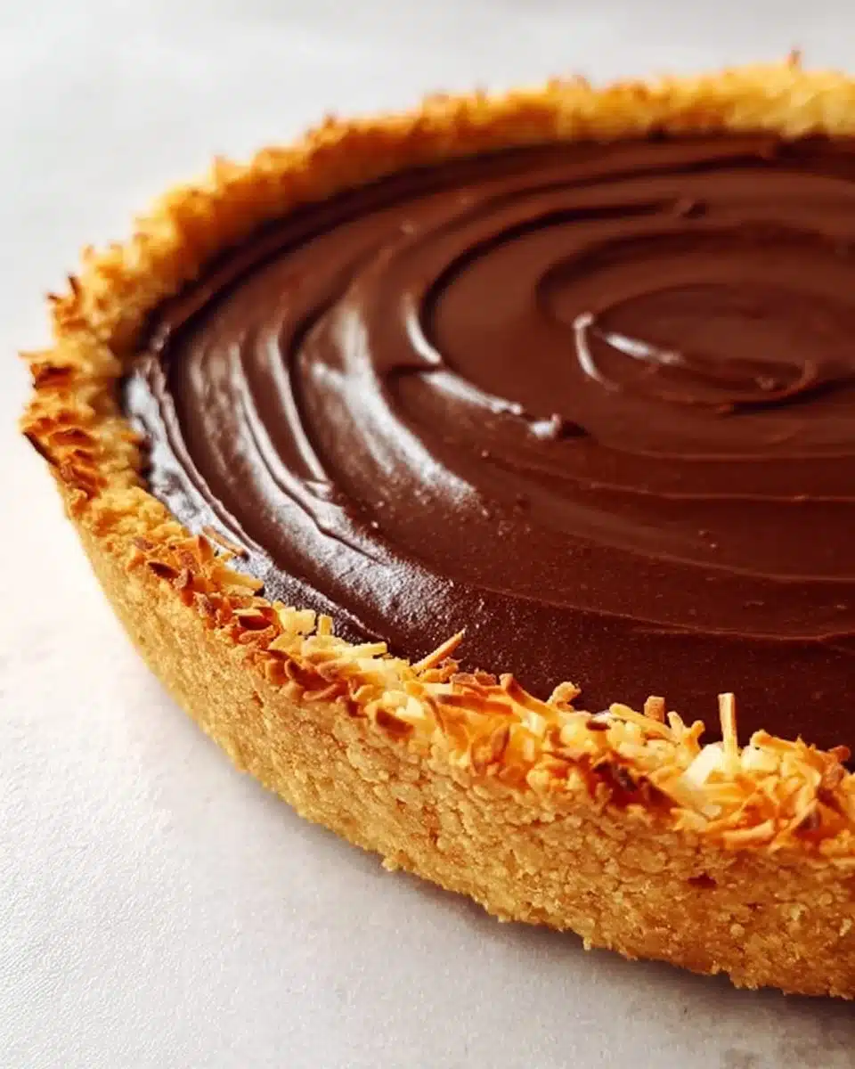 Delicious Chocolate Macaroon Tart with rich chocolate and coconut topping.