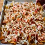 Delicious Crab Rangoon Nachos topped with creamy filling and crispy wonton chips