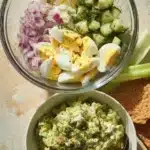 Herby avocado egg salad served in a bowl, ready for a nutritious meal.