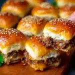 Delicious homemade juicy cheeseburger sliders served on a platter.