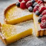 Delicious lemon tart with a golden crust and vibrant yellow filling