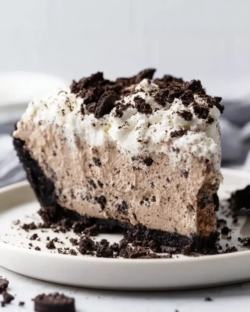 Delicious Oreo Pudding Pie with creamy filling and cookie crust