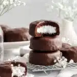 Retro-style mini chocolate cakes with marshmallow filling placed on a vintage plate